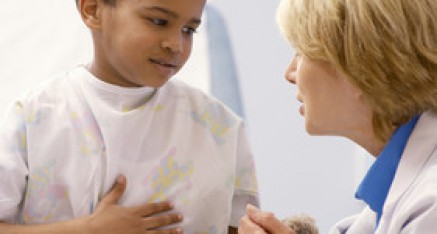 Pediatric gastroenterologist with a young patient